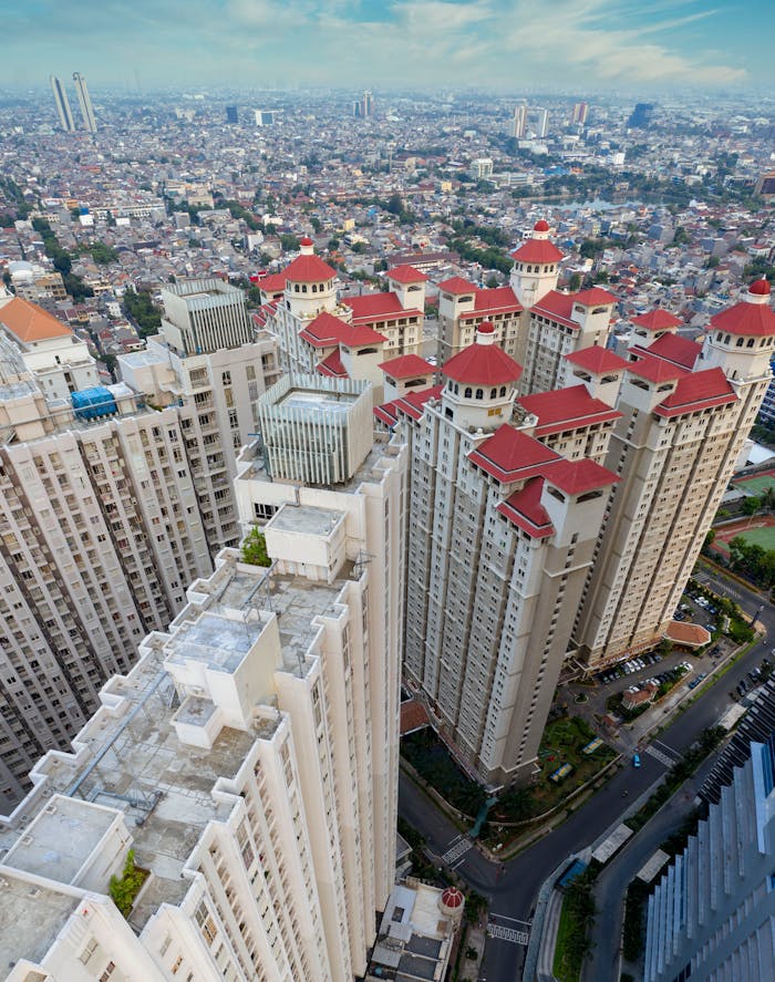 Aerial view of modern high-rise buildings in Jakarta, Indonesia, showcasing urban architecture.